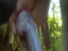 When having oral sex with their dog outside, the unclean young pet owner dons a wild brute mask.